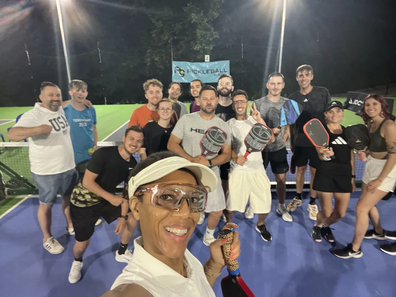 Alicia with pickleball players after a session