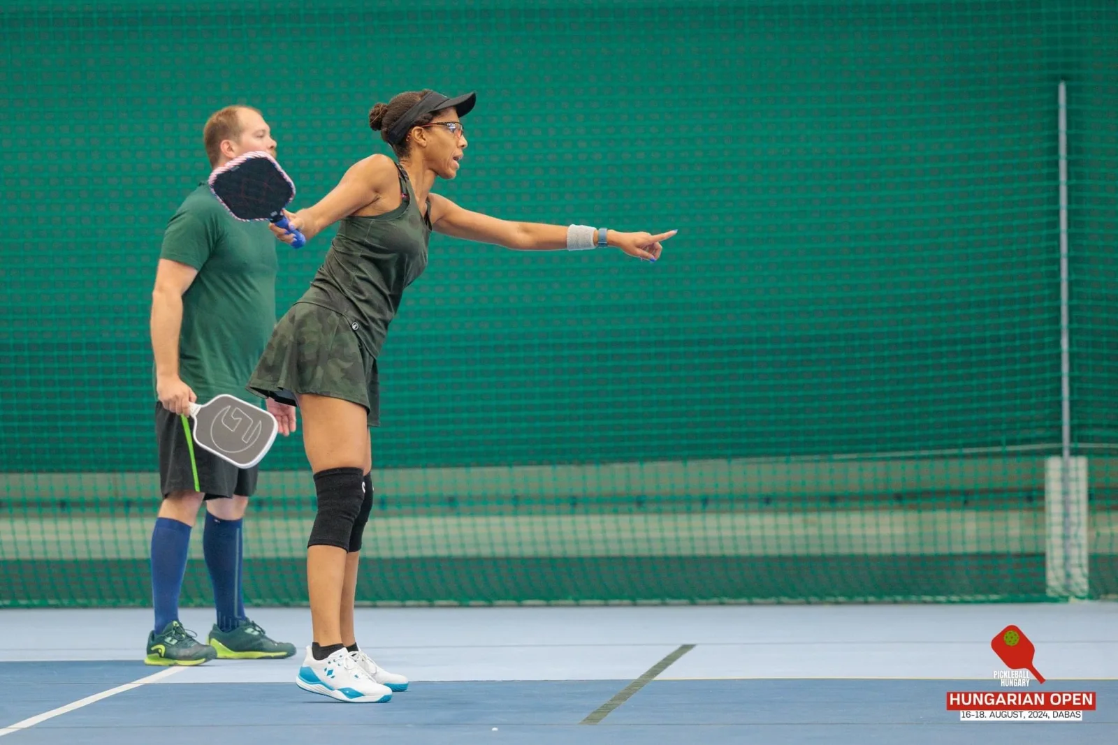 Alicia demonstrating pickleball technique on court