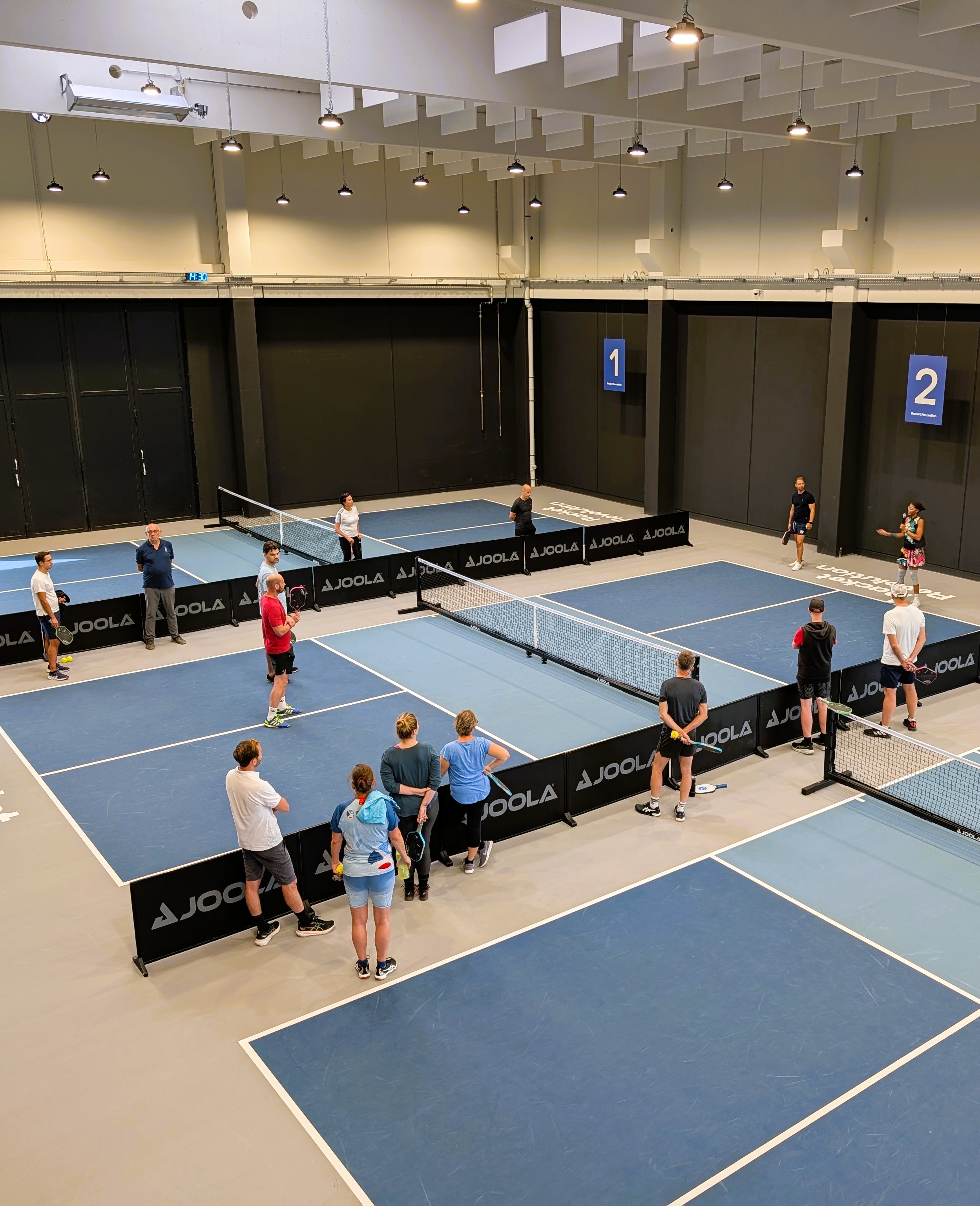 Alicia hosting a corporate pickleball team-building session
